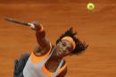 Serena Williams from U.S. serves the ball during the Madrid Open tennis tournament match against Sloane Stephens from U.S. in Madrid, Spain, Monday, May 4, 2015. (AP Photo/Daniel Ochoa de Olza)