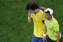 Brazil's David Luiz is consoled by teammate Thiago Silva as they walk off the pitch after the World Cup semifinal soccer match between Brazil and Germany at the Mineirao Stadium in Belo Horizonte, Brazil, Tuesday, July 8, 2014. Germany has routed host Brazil 7-1 and advanced to the final of the World Cup. (AP Photo/Felipe Dana, Pool)