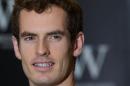 British tennis player Andy Murray poses for pictures at a bookstore in London, on November 6, 2013