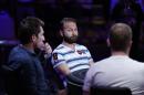 Daniel Negreanu, center, competes at the World Series of Poker main event Tuesday, July 14, 2015, in Las Vegas. (AP Photo/John Locher)