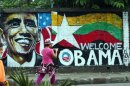 A woman takes a photo of a wall painting created by Myanmar graffiti artists to welcome U.S. President Barack Obama on a street in Yangon, Myanmar, Saturday, Nov. 17, 2012. Obama will visit Myanmar on Monday, in a first for a sitting U.S. president. White House officials on Thursday said he will use his visit "to lock down progress and to push on areas where progress is urgently needed" — most notably freeing political prisoners and ending ethnic tensions in the western state of Rakhine and the northern state of Kachin. Obama's stop in Myanmar, scheduled to last about six hours, is the centerpiece of his first foreign tour since winning re-election. (AP Photo)