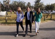 Tony Abbott (C), who leads the conservative opposition, arrives with his daughters Bridget (L) and Frances to cast his vote on election day at the Freshwater Beach Surf Lifesaving Club in Sydney September 7, 2013. REUTERS/David Gray