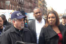 Rick Del Rio, pastor of Abounding Grace church in Manhattan, and New York City Public Advocate Letitia James, display a damaged but intact Bible they said was recovered in the rubble of the Spanish Christian Church, Saturday, March 15, 2014 in New York. The church was in one of the buildings destroyed in the March 12 gas explosion that leveled two building and killed eight people. (AP Photo/Jim Fitzgerald)