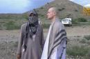 U.S. Army Sergeant Bowe Bergdahl waits before being released at the Afghan border