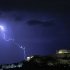 Lightening illuminates the ancient Parthenon temple atop the Acropolis hill in Athens on Sunday Oct. 14, 2012. Greece is inching towards an agreement with its international debt inspectors as they struggle to hammer out the details of euro13.5 billion ($17.5 billion) in austerity measures for the next two years, a package essential for Greece to receive the next installment of its vital bailout funds. (AP Photo/Dimitri Messinis)