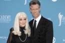 FILE - In this April 18, 2010 file photo, country singer Randy Travis, right, and then wife Elizabeth arrive at the 45th Annual Academy of Country Music Awards in Las Vegas. Travis has filed a countersuit against his ex-wife claiming she's been divulging confidential information about the country music singer that was calculated to damage his reputation and career. The court documents filed recently in a federal court in Nashville don't say what information Elizabeth Travis is alleged to have revealed. The filings are the latest salvo in the feud between the Travises. The couple divorced in 2010 after 19 years of marriage. Elizabeth Travis had been his manager for more than three decades. She sued him last month claiming that Randy Travis made it impossible for her to do her job and terminated her management contract without proper written notice. (AP Photo/Dan Steinberg, file)