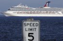 The cruise ship Carnival Triumph into Mobile Bay near Dauphin island, Ala., Thursday, Feb. 14, 2013. The ship with more than 4,200 passengers and crew members has been idled for nearly a week in the Gulf of Mexico following an engine room fire. (AP Photo/Dave Martin)