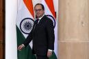 French President Hollande and India's Prime Minister Modi arrive for a photo opportunity ahead of their meeting at Hyderabad Hose in New Delhi