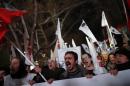 Demonstrators protest against Turkey's ruling Ak Party and demand the resignation of Prime Minister Tayyip Erdogan in Ankara