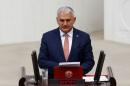 Turkey's new Prime Minister Binali Yildirim reads his government's programme at the Turkish parliament in Ankara