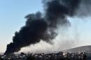 Smoke rises after an airstrike from US-led coalition against IS militants in the Syrian town of Kobane on November 8, 2014