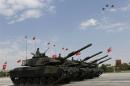 Turkish army tanks and aircrafts take part in a parade marking the 91st anniversary of Victory Day in Ankara
