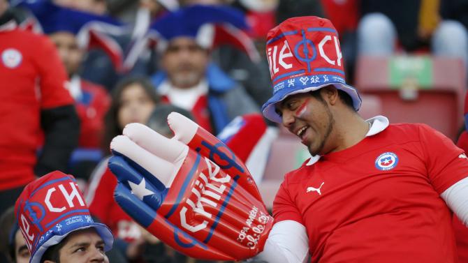 Chile fans celebrate before the opening soccer match against Ecuador in the Copa America Chile 2015 at National Stadium in Santiago