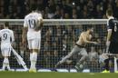 Players watch a pitch invader during the Europa League group C soccer match between Tottenham Hotspur and Partizan Belgrade at White Hart Lane stadium in London, Thursday, Nov. 27, 2014 .(AP Photo/Alastair Grant)