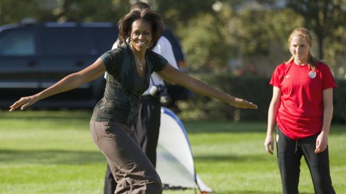 FILE - In this Oct. 6, 2011, file photo, first lady Michelle Obama plays soccer on the South Lawn of the White House in Washington, as part of a Let&#39;s Move! clinic. The nation’s first lady turns 50 on Friday and, by her own account, feels more relaxed now that President Barack Obama’s days as a candidate for elected office are over. (AP Photo/Evan Vucci)