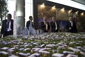 A delegation looks at a scale model of the new Egyptian&nbsp;&hellip;