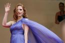 Actress Jessica Chastain poses for photographers as she arrives for the screening of Foxcatcher at the 67th international film festival, Cannes, southern France, Monday, May 19, 2014. (AP Photo/Alastair Grant)