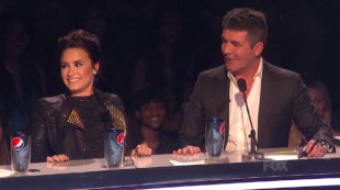 X Factor USA's Simon Cowell And Demi Lovato Lash Out At Each Other 