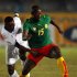 Cameroon's Webo is challenged by Democratic Republic of Congo's Tshiolola during their African Nations Cup in Cairo