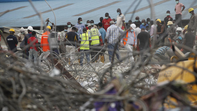 Rescue workers search for survivors in the rubble of a collapsed building belonging to the Synagogue Church of All Nations in Lagos, Nigeria, Tuesday Sept. 16, 2014. Rescue workers early Tuesday dug a woman out of the rubble of a building that collapsed four days ago and she walked away with only a slight injury, a government spokesman said. The death toll rose to 60 by Tuesday afternoon from the fallen multistory building serving as a shopping mall and guesthouse at the sprawling campus of televangelist T.B. Joshua&#39;s Synagogue, Church of All Nations, on the outskirts of Lagos, Nigeria&#39;s commercial capital. (AP Photo/Sunday Alamba)