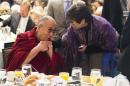 Valerie Jarrett, senior adviser to President Barack Obama, right, talks with the Dalai Lama during the National Prayer Breakfast in Washington, Thursday, Feb. 5, 2015. The annual event brings together U.S. and international leaders from different parties and religions for an hour devoted to faith. (AP Photo/Evan Vucci)