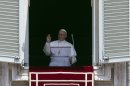 Pope Francis blesses the crowd during the Angelus noon prayer, from the window of his studio overlooking St. Peter's Square, at the Vatican, Sunday, June 2, 2013. (AP Photo/Andrew Medichini)