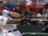 Texas Rangers' Adrian Beltre follows through on hitting a home run during the fourth inning of a baseball game against the Baltimore Orioles, Wednesday, Aug. 22, 2012, in Arlington, Texas. (AP Photo/LM Otero)
