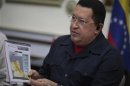 Venezuelan President Chavez points at a map as he speaks during a Council of Ministers at Miraflores Palace in Caracas