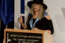 Entertainment star Barbra Streisand speaks during a ceremony at the Hebrew University in Jerusalem after she received an honorary doctorate in Jerusalem, Monday, June 17, 2013. Streisand waded into one of Israel's touchiest issues Monday on the first major stop of her tour of the country Jewish religious practices that separate men and women. (AP Photo/Dan Balilty)