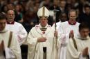 Pope Francis walks with the pastoral staff at the end of the Christmas Eve Mass in St. Peter's Basilica at the Vatican, Tuesday, Dec. 24, 2013. (AP Photo/Gregorio Borgia)