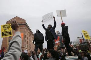 Thousands march in Baltimore to protest black mans death, some.