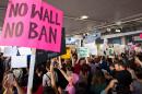 Protesters gather at the Los Angeles International airport's Tom Bradley terminal to demonstrate against President Trump's executive order effectively banning citizens from seven Muslim majority countries