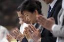 South Korean President Park Geun-hye prays during a serves to pay tribute to victims of the sunken ferry Sewol at a Catholic church in Seoul, South Korea, Sunday, May 18, 2014. The ferry disaster left more than 200 people dead, with others still missing. Government and civilian divers are fighting rapid currents as they try to retrieve the remaining bodies. (AP Photo/Yonhap, Do Kwang-hwan) KOREA OUT