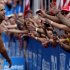 Jordan Rapp, left, greets the crowd after winning the Ironman U.S. Championship triathlon in New York, Saturday, Aug. 11, 2012.  (AP Photo/Craig Ruttle)