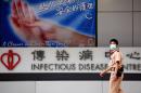 A hospital guard wearing a mask walks past the infectious disease centre at the Princess Margaret Hospital in Hong Kong on May 17, 2009