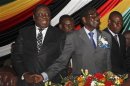 Zimbabwe's President Mugabe and PM Tsvangirai attend a conference reviewing a draft constitution in Harare