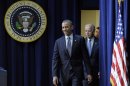 President Barack Obama, followed by Vice President Joe Biden, arrives in the South Court Auditorium at the White House in Washington, Wednesday, Jan. 16, 2013, to talk about proposals to reduce gun violence. (AP Photo/Susan Walsh)