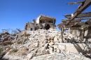 Civil defense members search for survivors under the rubble at a site hit by airstrikes in the rebel-controlled town of Ariha, Syria. (Ammar Abdullah/Reuters)