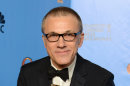 Christoph Waltz poses with the award for best performance by an actor in a supporting role in a motion picture for 