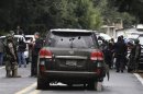A bullet-riddled armoured U.S. embassy SUV is seen on a road near the town of Tres Marias