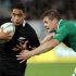 All Blacks player Aaron Smith (left) gets past the tackle of Brian O'Driscoll