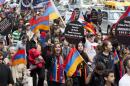 Pro-Armenian activists march in midtown Manhattan in New York to mark the centennial of the killings of as many 1.5 million Armenians under the Ottoman Empire _ today's Turkey _ on Sunday, April 26, 2015. The activists are demanding that the U.S. government acknowledge the deaths during World War I as genocide. (AP Photo/Mark Lennihan)