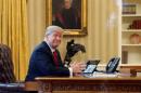 U.S. President Donald Trump waits to speak by phone with the Saudi Arabia's King Salman in the Oval Office at the White House in Washington