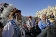 Native Americans wait for the start of a canonization ceremony celebrated by Pope Benedict XVI, in St. Peter's Square, at the Vatican, Sunday, Oct. 21, 2012. The pontiff will canonize seven people, Kateri Tekakwitha, the first Native American saint from the U.S., Maria del Carmen, Pedro Calungsod, Jacques Berthieu, Giovanni Battista Piamarta, Mother Marianne Cope, and Anna Shaeffer. (AP Photo/Andrew Medichini)