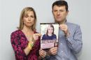 File photograph shows Kate and Gerry McCann posing with a computer generated image of how their missing daughter Madeleine might look, during a news conference in London