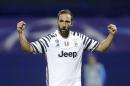 Juventus's Gonzalo Higuain celebrates after team mate Miralem Pjanic scored his side's first goal during the Champions League Group H soccer match between Dinamo Zagreb and Juventus, at Maksimir stadium in Zagreb, Croatia, Tuesday, Sept. 27, 2016. (AP Photo/Darko Bandic)