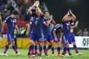 The Japan players wave to the crowd after winning their AFC Asia Cup soccer match against Iraq in Brisbane, Australia, Friday, Jan. 16, 2015. (AP Photo/Tertius Pickard)