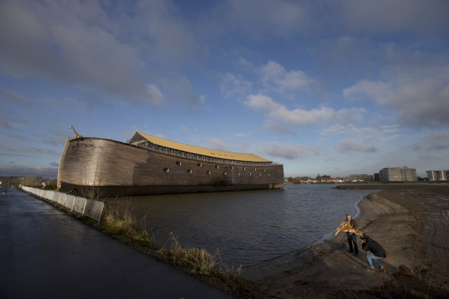<p>               Johan Huibers, bottom right, poses, after being asked by a photographer to go outside, with a stuffed tiger in front of the full scale replica of Noah’s Ark in Dordrecht, Netherlands, Monday Dec. 10, 2012. The Ark has opened its doors in the Netherlands after receiving permission to receive up to 3,000 visitors per day. For those who don’t know or remember the Biblical story, God ordered Noah to build a boat massive enough to save animals and humanity while God destroyed the rest of the earth in an enormous flood. (AP Photo/Peter Dejong)