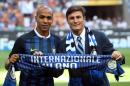 New Inter Milan Portoguese midfielder Joao Mario, left, poses with team's vice president Javier Zanetti prior to a Serie A soccer match between Inter Milan and Palermo, at the Milan San Siro stadium, Italy, Sunday, Aug. 28, 2016. (Matteo Bazzi/ANSA via AP)