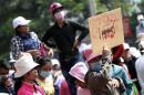 A garment worker holds a placard during a protest in central Phnom Penh
